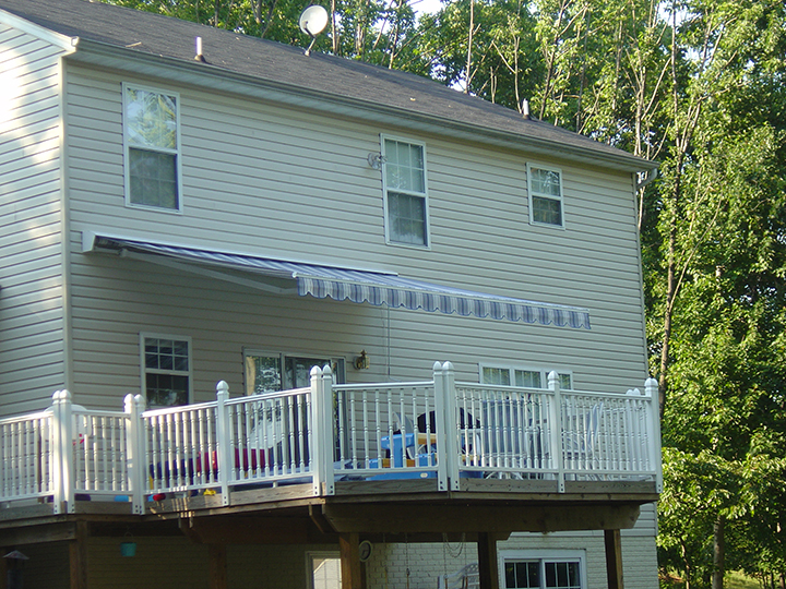awning extended over a deck with white railings